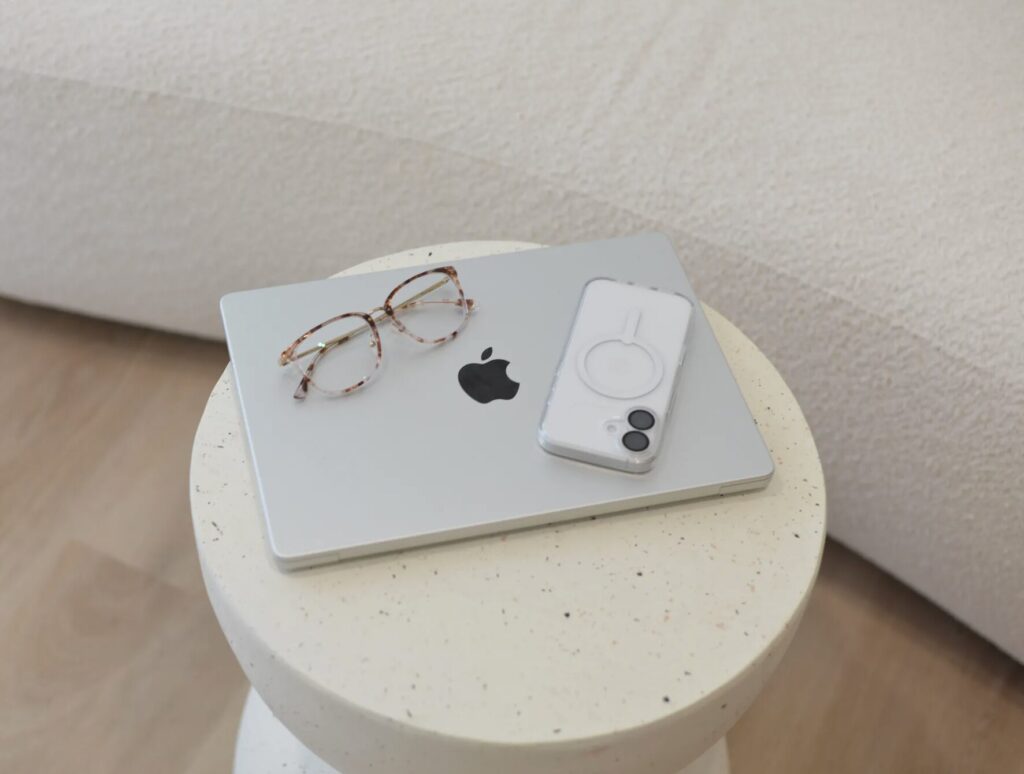 Laptop on table with iPhone ready for Social Media